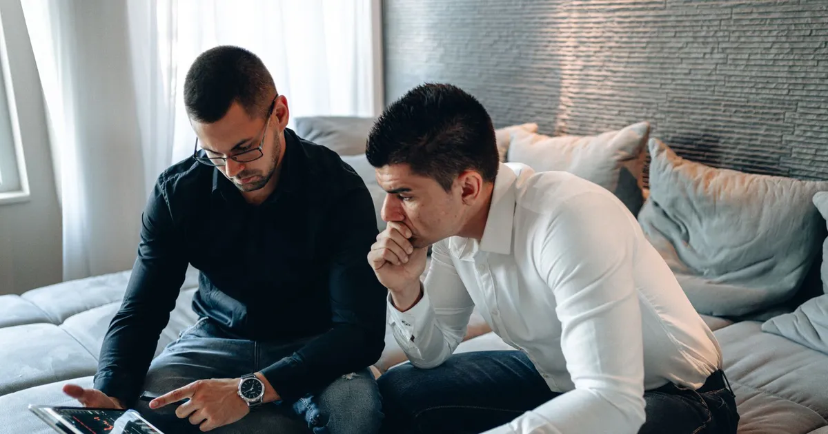 Couple reviewing a $1500 loan no credit check offer on a tablet at home