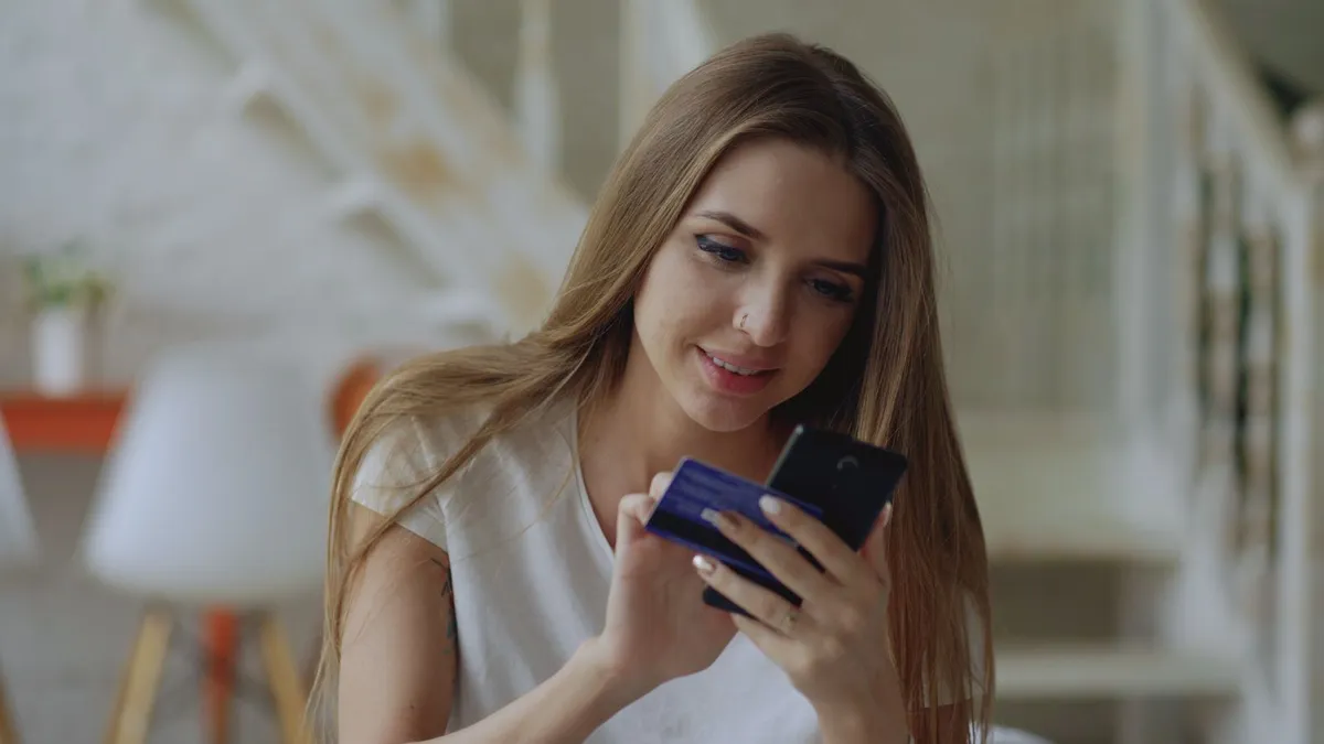 Person receiving an Interac e-transfer deposit notification on a phone